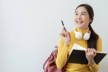 Portrait beautiful Asian woman student. Smile girl happy study. read book in college campus. young female on international Asia University. Education, study, school, learning, exam, continue education