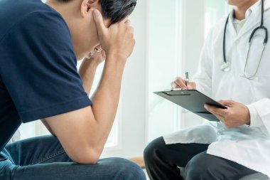 man with mental health problems is consulting. psychiatrist is recording the patient's condition for treatment. encouragement, love and family problem, bipolar , depression patient, protect suicide