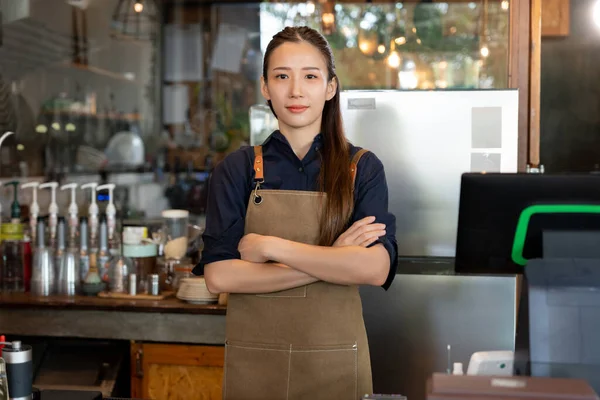 Business woman owner open on the first day of business. guarantees safety, cleanliness, open the coffee shop. open for New normal. Small business, welcome, restaurant, home made
