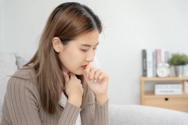 sick woman with a headache and feeling cold on sofa, female sneezing and runny nose with seasonal influenza, allergic, high fever and influenza, resting, virus, coronavirus, feel illness, respiratory