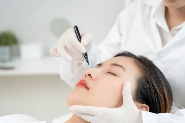 plastic surgery, beauty, Surgeon or beautician touching woman face, surgical procedure that involve altering shape of nose, doctor injection to prepare for rhinoplasty, medical assistance, healt