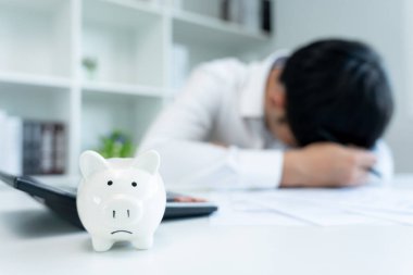 Stressed and headache man with large bills or invoices no money to pay to expenses and credit card debt. shortage, Financial problem, bankruptcy, mortgage, loan, bankrupt, poor, empty wallet 