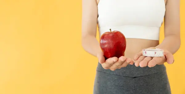 slim body asian women choose healthy foods, dieting female choose red apple for diet. Good healthy food. weight lose, balance, control, reduce fat, low calories, routines, exercise, body shape.