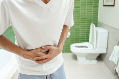 stomach ache. Asian women have abdominal pain, indigestion, gastritis, menstrual cramps, flatulence, diarrhea, distention, colon cancer, belly inflammation problem, suffer food poisoning, abdomen