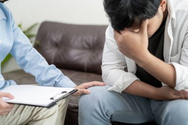 man with mental health problems is consulting. psychiatrist is recording the patient's condition for treatment. encouragement, love and family problem, bipolar , depression patient, protect suicide
