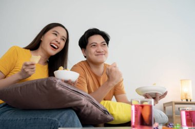 cheerful couple cheer sport, watching sporting, cheering for victory of their team. Happy energetic smiling. tv show, holiday, relax, recreation, soccer, football, series, cinema, cheer, win, fan club