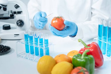 Scientist check chemical food residues in laboratory. Control experts inspect quality of fruits, vegetables. lab, hazards, ROHs, find prohibited substances, contaminate, Microscope, Microbiologist