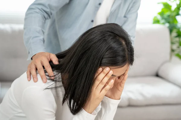 Couple support each while discussing family issues with psychiatrist. wife encourages and empathy husband suffers depression. psychological, divorce, trust, care, workplace and health issues