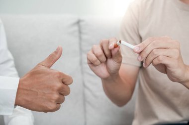 No smoking. Man stop smoke, refuse, reject, break take cigarette, say no. quit smoking for health. world tobacco day. drugs, Lung Cancer, emphysema , Pulmonary disease, narcotic, nicotine effect