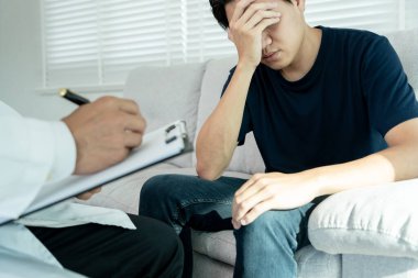 man with mental health problems is consulting. psychiatrist is recording the patient's condition for treatment. encouragement, love and family problem, bipolar , depression patient, protect suicide