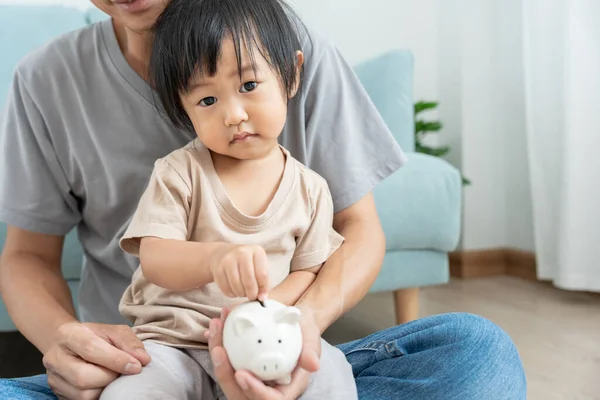 Save money. children putting coin for saving. wealth, Finance, insurance, investment, education, future, plan life, learn, banking, family, health, health and accident insurance.