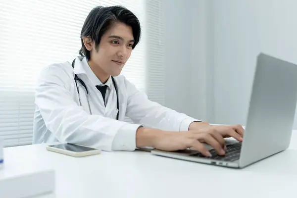 telemedical. Doctors are advising patients over the Internet by video conference. Asian doctor is treating patients through telecommunication while describing the disease . Technology for health.
