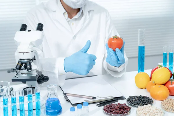 stock image Scientist guaranteer no chemical on fruit residues in laboratory. Control experts inspect the concentration of chemical residues, standard, find prohibited substances, contaminate, Microbiologist