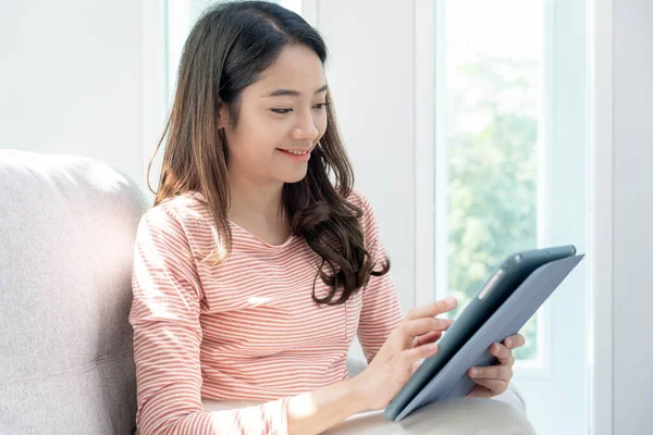 woman using tablet for online shopping at home. stay home, technology, electronic commerce, internet, market place, final or summer or big sale, payment, discount for credit, offer, Low price