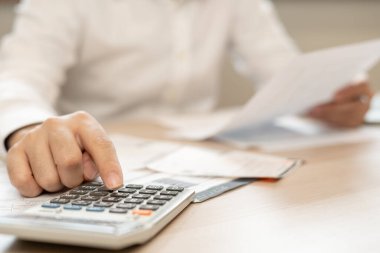 Stressed and headache man with large bills or invoices no money to pay to expenses and credit card debt. shortage, Financial problem, bankruptcy, mortgage, loan, bankrupt, poor, empty wallet 