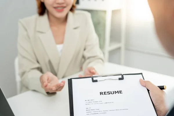 Executives accept job application documents and read job applicants resume to match the position. company publishes vacancies online to find human. Human resource, interview, letters, competence.