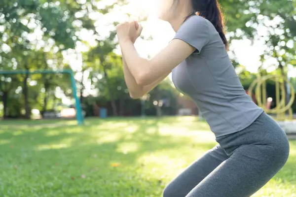 health care female exert on the park. Asian woman doing exercises in morning. balance, recreation, relaxation, calm, good health, happy, relax, healthy lifestyle, reduce stress, peaceful, Attit