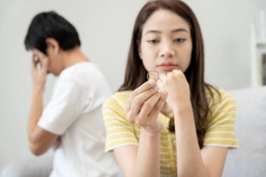 Divorce. Woman remove married ring. Couples desperate and disappointed after marriage. Husband wife sad, upset and frustrated after quarrels conflict. distrust, love problems, betrayals, family, lover