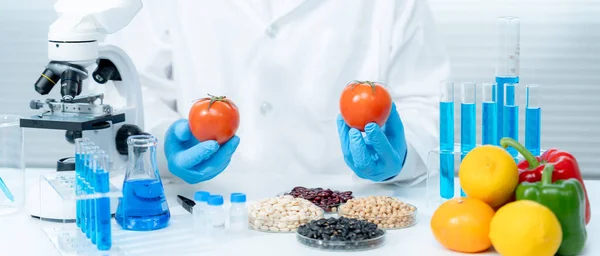 Scientist check chemical food residues in laboratory. Control experts inspect quality of fruits, vegetables. lab, hazards, ROHs, find prohibited substances, contaminate, Microscope, Microbiologis
