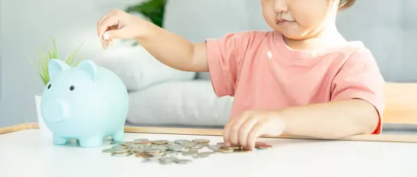 Save money. children putting coin for saving. wealth, Finance, insurance, investment, education, future, plan life, learn, banking, family, health, health and accident insurance
