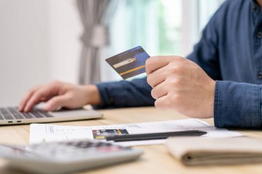 Stressed and headache man with large bills or invoices no money to pay to expenses and credit card debt. shortage, Financial problem, bankruptcy, mortgage, loan, bankrupt, poor, empty wallet 