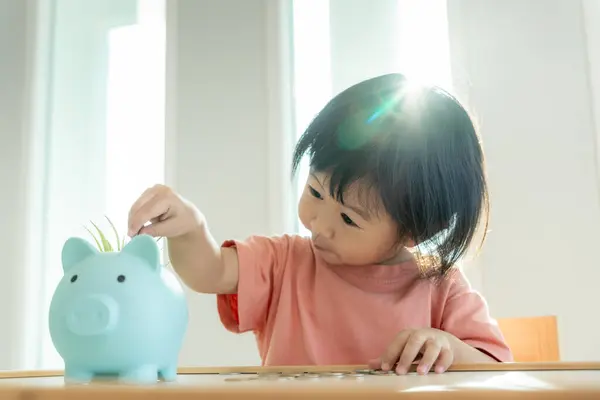 Save money. children putting coin for saving. wealth, Finance, insurance, investment, education, future, plan life, learn, banking, family, health, health and accident insurance.
