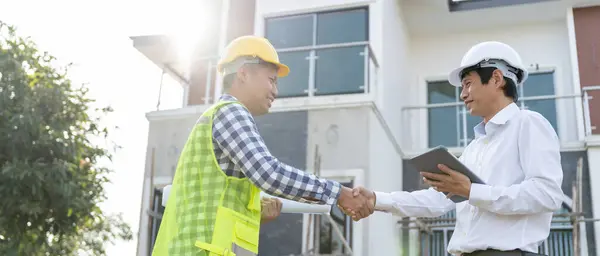 Construction team hands shaking greeting start up plan new project contract in office center at construction site, industry ,architecture, partner, teamwork, agreement, property, contacts