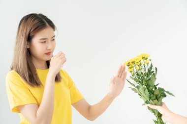 Pollen Allergies, asian young woman sneezing in a handkerchief or blowing in a wipe, allergic to wild spring flowers or blossoms during spring. allergic reaction, respiratory system problems clipart