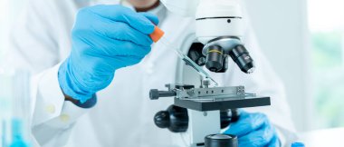 Scientist analyze biochemical samples in advanced scientific laboratory. Medical professional use dropper mix microbiological developmental of viral. Biotechnology research in  science lab. cosmetic