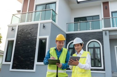 inspector engineer and owner project is inspecting construction and quality assurance new house. Engineers or architects or contactor work to build the house before handing it over to the homeowner