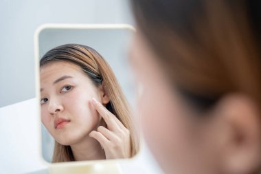 Woman worried about face Dermatology, rosacea dermatitis, allergic steroids, sensitive skin, red face from sunburn, acne, dry skin, large pores ,rash face, dull, freckles, wrinkle, skin problem, beauty