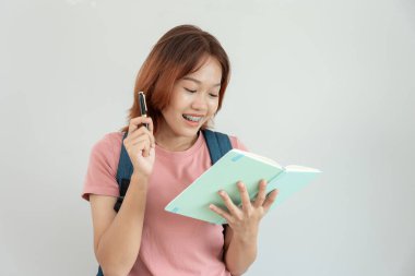 Portrait beautiful Asian woman student. Smile girl happy study. read book in college campus. young female on international Asia University. Education, study, school, learning, exam, continue education