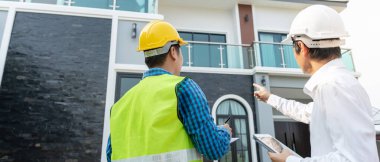 inspector engineer and owner project is inspecting construction and quality assurance new house. Engineers or architects or contactor work to build the house before handing it over to the homeowner
