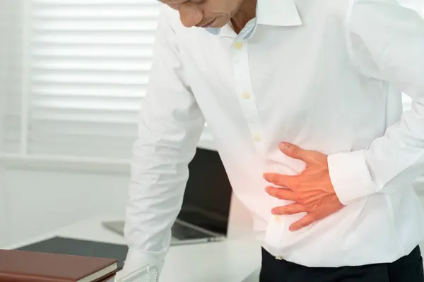 stock image stomach ache. men have abdominal pain, indigestion, gastritis, flatulence, diarrhea, distention, colon cancer, belly inflammation problem, suffer food poisoning, abdomen, acid reflux