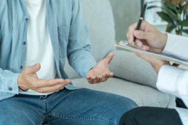 man with mental health problems is consulting. psychiatrist is recording the patient's condition for treatment. encouragement, love and family problem, bipolar , depression patient, protect suicide