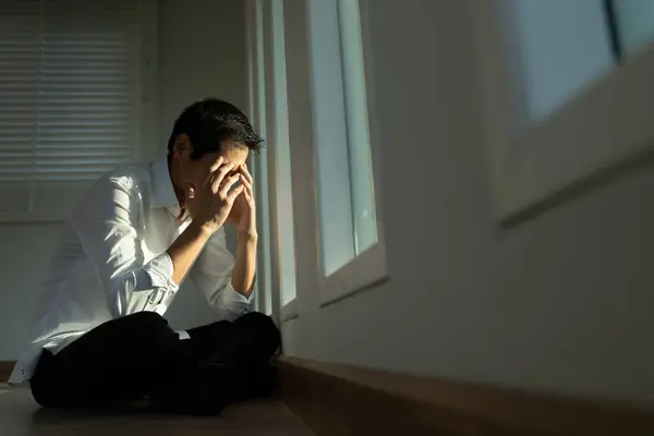 stock image Depression and mental illness. Asian man disappoint, sad after receive bad news. Stressed boy confused with unhappy problem, arguing with girlfriend, cry and worry about unexpected work, down economy