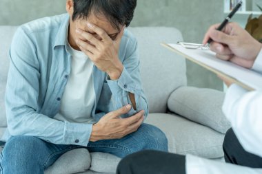 man with mental health problems is consulting. psychiatrist is recording the patient's condition for treatment. encouragement, love and family problem, bipolar , depression patient, protect suicide