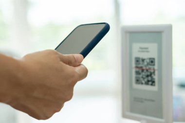 Woman use smartphone to scan QR code to pay in cafe restaurant with a digital payment without cash. Choose menu and order accumulate discount. E wallet, technology, pay online, credit card, bank app