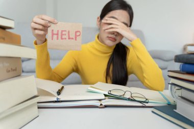 Asian student woman have anxiety because of exams, female prepare for test and learning lessons in the library. stress, despair, haste, misunderstanding reading, discouraged, expectation, knowledge