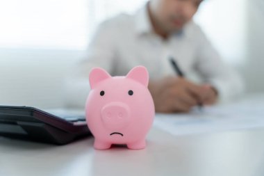 Stressed and headache man with large bills or invoices no money to pay to expenses and credit card debt. shortage, Financial problem, bankruptcy, mortgage, loan, bankrupt, poor, empty wallet 