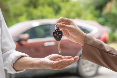 lease, rental car, sell, buy. Dealership manager send car keys to the new owner.  Sales, loan credit financial, rent vehicle, insurance,  renting, Seller, dealer, installment, car care busines