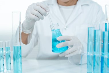 Scientist analyze biochemical samples in advanced scientific laboratory. Medical are mixing chemicals to test physical properties of cosmetic. develop viral. Biotechnology research in science lab