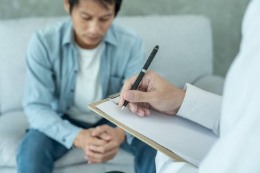 man with mental health problems is consulting. psychiatrist is recording the patient's condition for treatment. encouragement, love and family problem, bipolar , depression patient, protect suicide