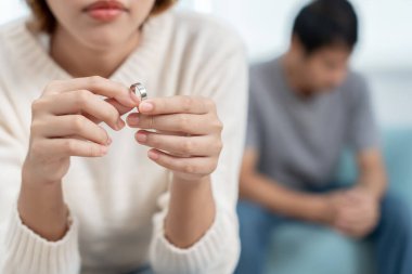 Divorce. Woman remove married ring. Couples desperate and disappointed after marriage. Husband wife sad, upset and frustrated after quarrels conflict. distrust, love problems, betrayals, family, lover