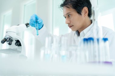 Scientist analyze biochemical sample in advanced scientific laboratory. Medical professional check chemical mix microbiological developmental of viral. Biotechnology research in science lab. cosmetic
