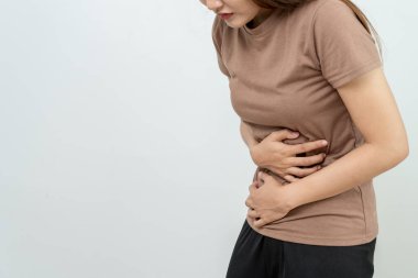 stomach ache. Asian women have abdominal pain, indigestion, gastritis, menstrual cramps, flatulence, diarrhea, distention, colon cancer, belly inflammation problem, suffer food poisoning, abdomen