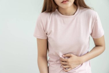 stomach ache. Asian women have abdominal pain, indigestion, gastritis, menstrual cramps, flatulence, diarrhea, distention, colon cancer, belly inflammation problem, suffer food poisoning, abdomen