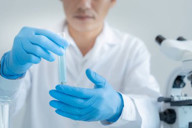 Scientist analyze biochemical sample in advanced scientific laboratory. Medical professional check chemical mix microbiological developmental of viral. Biotechnology research in science lab. cosmetic