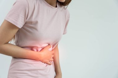 stomach ache. Asian women have abdominal pain, indigestion, gastritis, menstrual cramps, flatulence, diarrhea, distention, colon cancer, belly inflammation problem, suffer food poisoning, abdomen