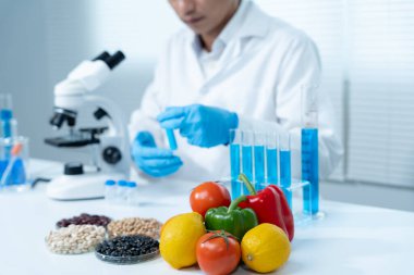 Scientist check chemical food residues in laboratory. Control experts inspect quality of fruits, vegetables. lab, hazards, ROHs, find prohibited substances, contaminate, Microscope, Microbiologist